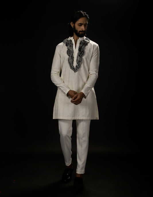 Textured Kurta Set With Relief Embroidery